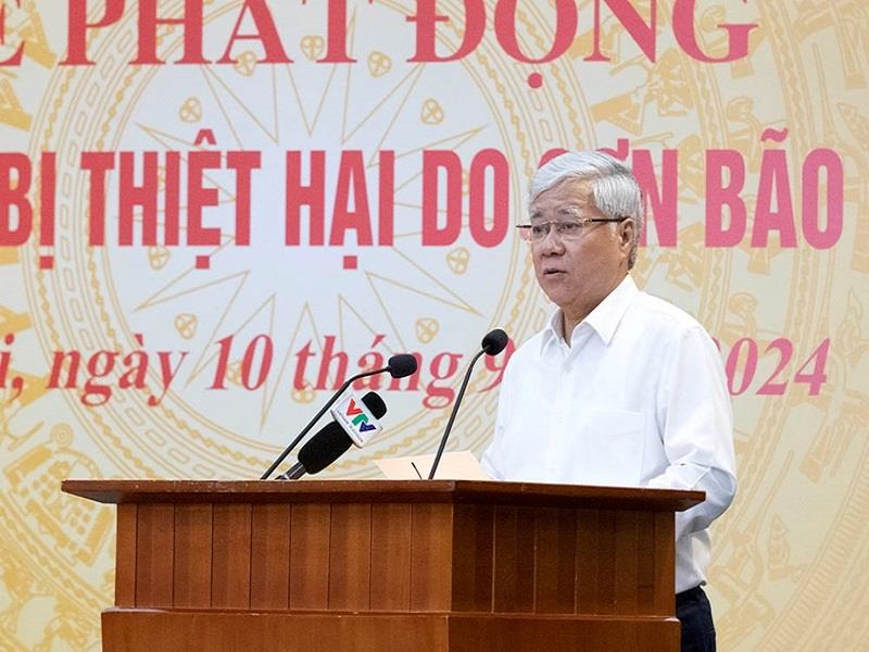 Đồng chí Đỗ Văn Chiến, Ủy viên Bộ Chính trị, Bí thư Trung ương Đảng, Chủ tịch Ủy ban Trung ương MTTQ Việt Nam, đọc lời kêu gọi tại Lễ phát động. (Ảnh: Phạm Cường)