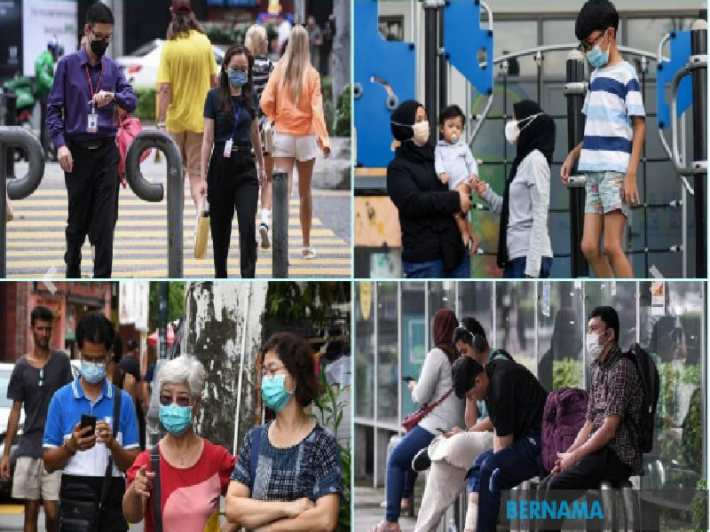 Bộ Y tế Malaysia khuyến cáo người dân đeo khẩu trang để phòng chống dịch COVID-19 (Ảnh: Bernama)